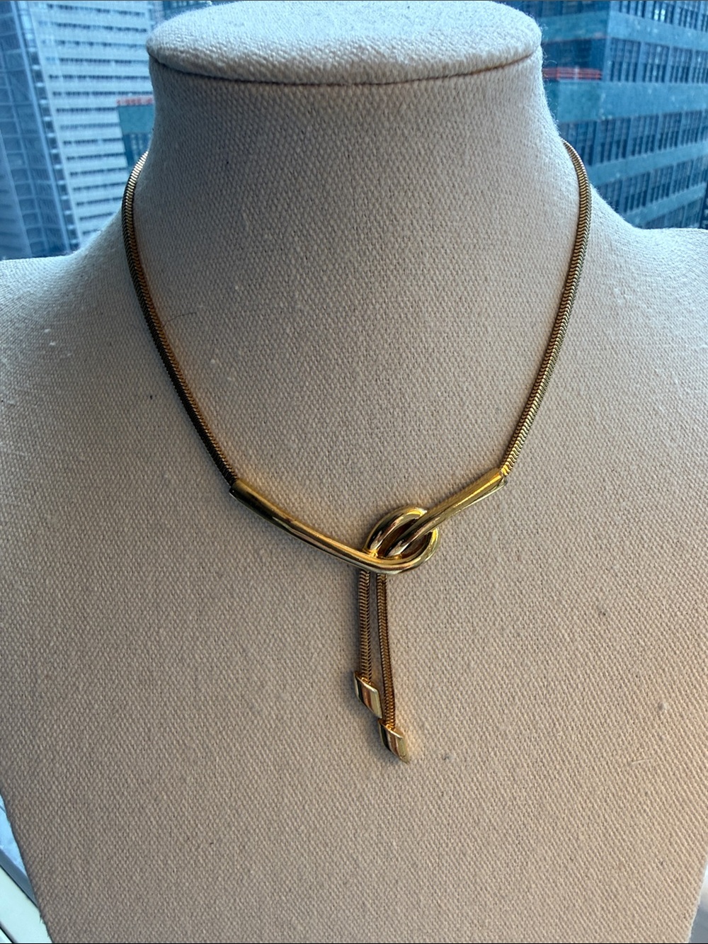 Vintage Monet Gold Tone Loop Knotted Lariat Necklace. Circa 1980’s. Signed.